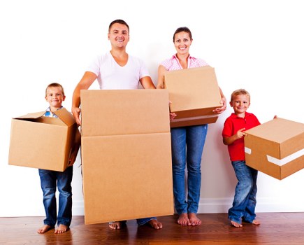 Team loading furniture safely into a moving van