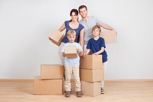 Packed moving boxes and household items ready for collection during a Harringay flat removal