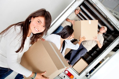 Careful loading of sofas and tables for a local move